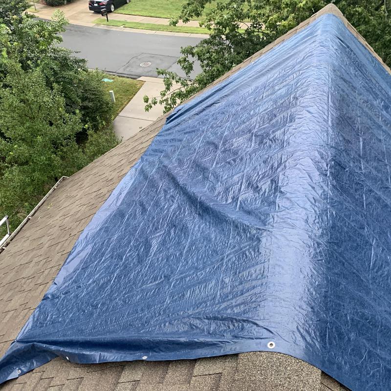 overhead view of a wind-damaged roof
